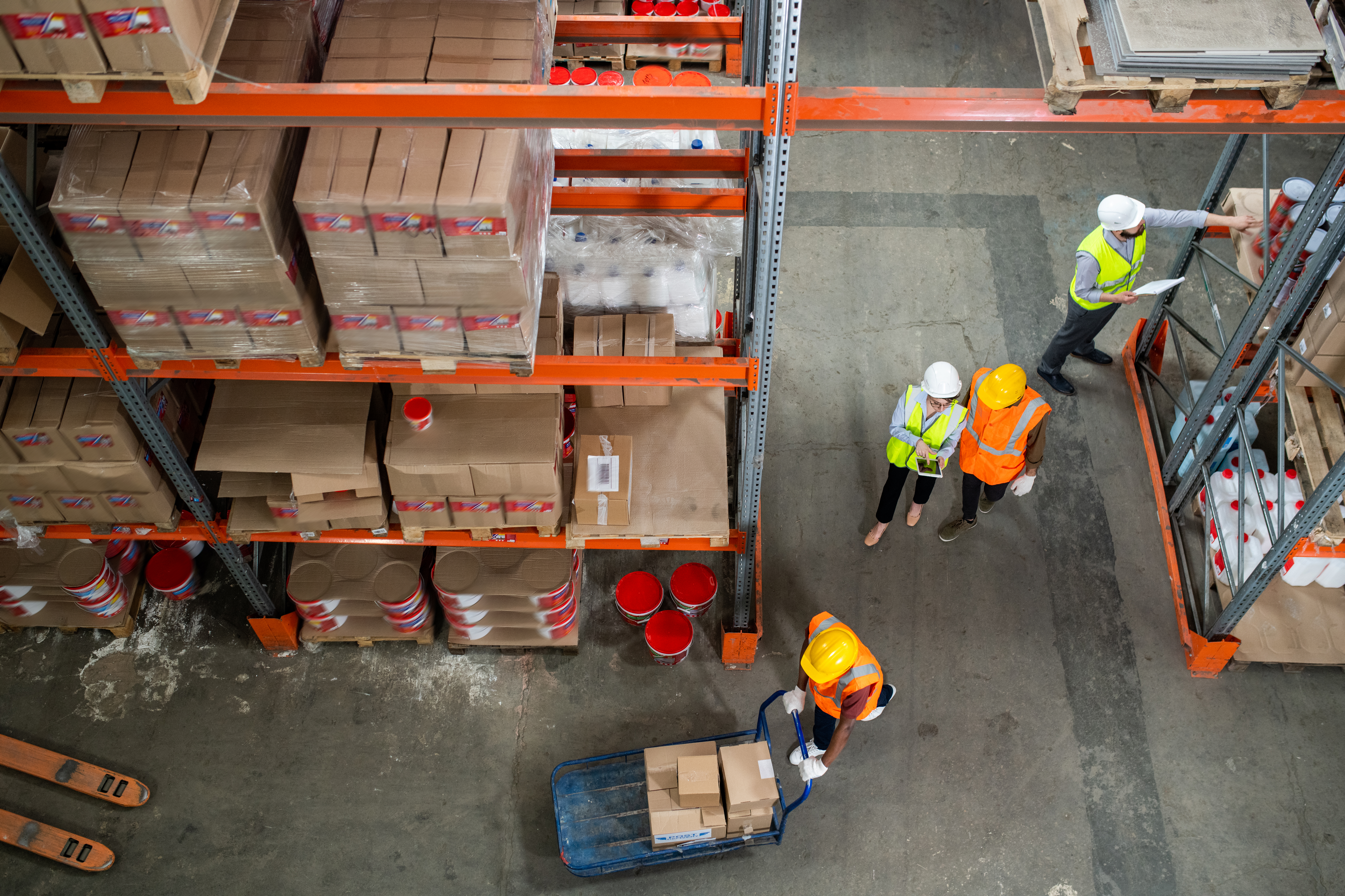 Warehouse staff managing inventory and stock replenishment processes in a modern distribution centre.